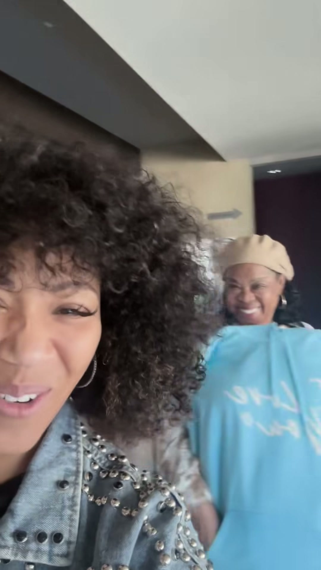 Erica Campbell smiling during Laugh, Cry, Heal event-day preparations