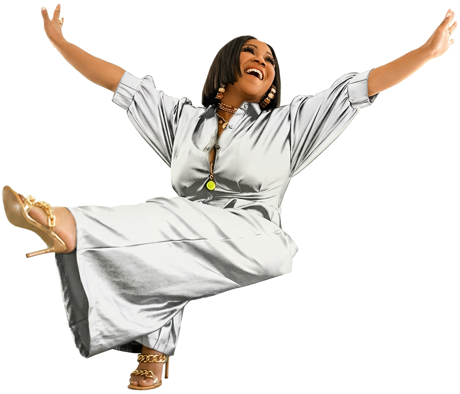 Erica Campbell smiling with her arms open in official Laugh, Cry, Heal campaign photography